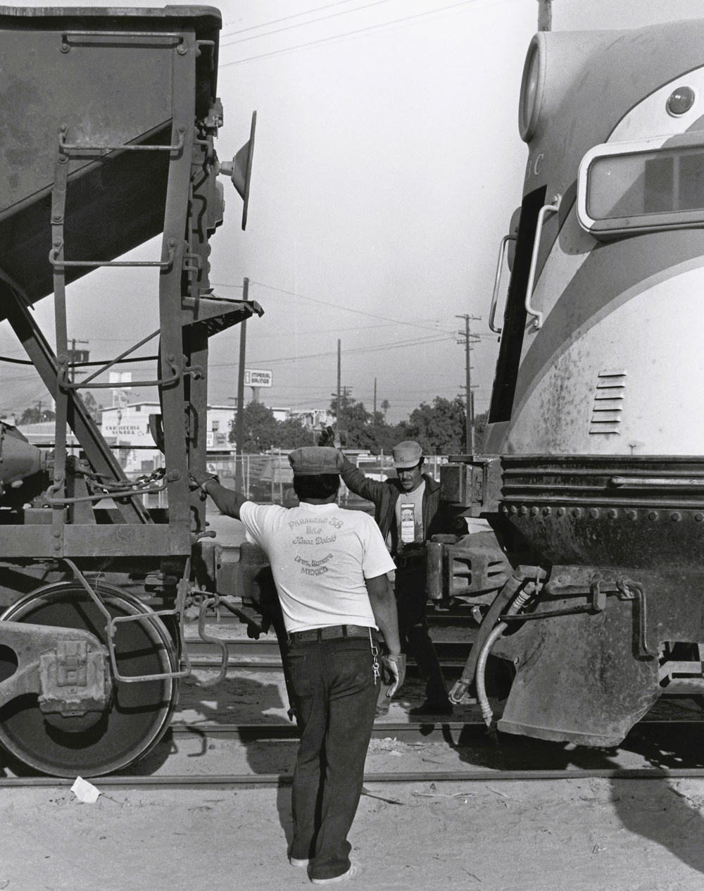 Crew member signaling between two trains