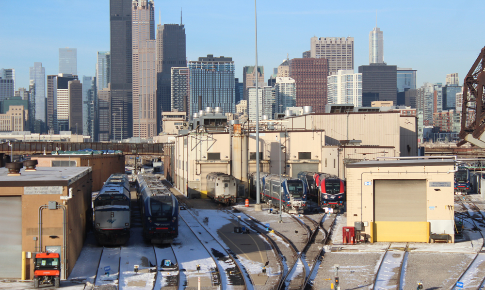 Locomotives at shop facility with Chicago skyline in background