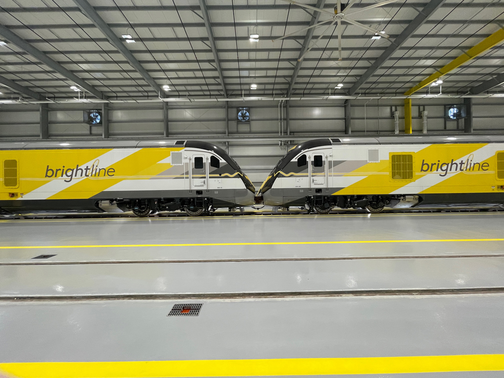 Two locomotives nose to nose in building