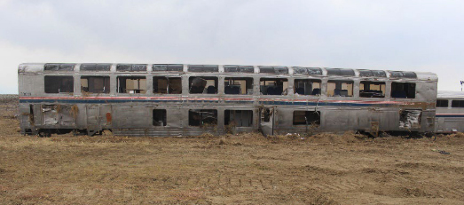 Damaged passenger car missing windows