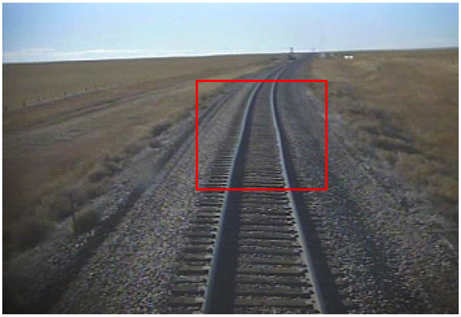 Still from locomotive on-board camera, with red square higlighting track defect