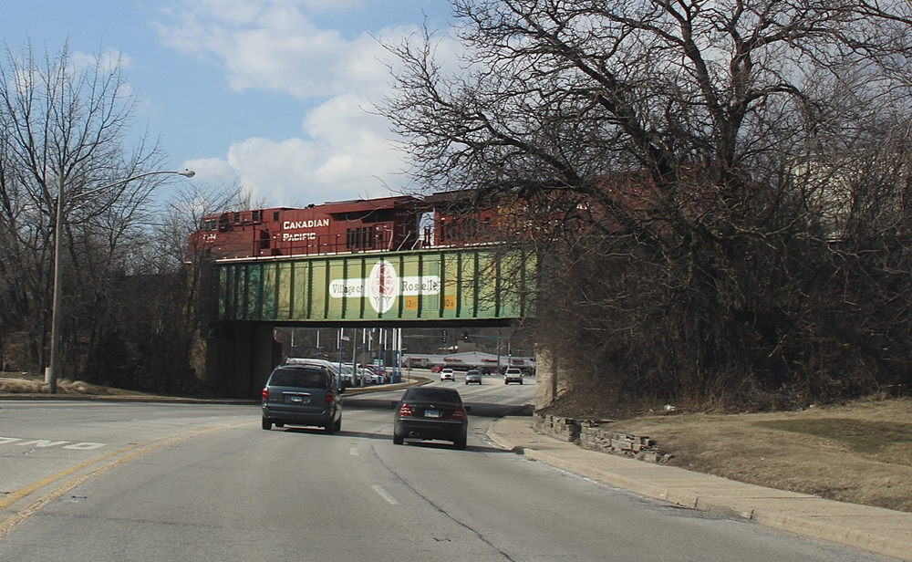 Train crossing bridge painted for city of Roselle, Ill.