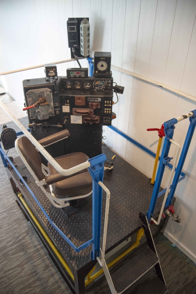 Locomotive cab simulator — a chair and control stand on a platform