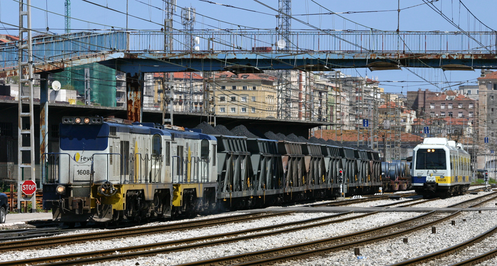 Diesel freight and passenger equipment in yard in Spain