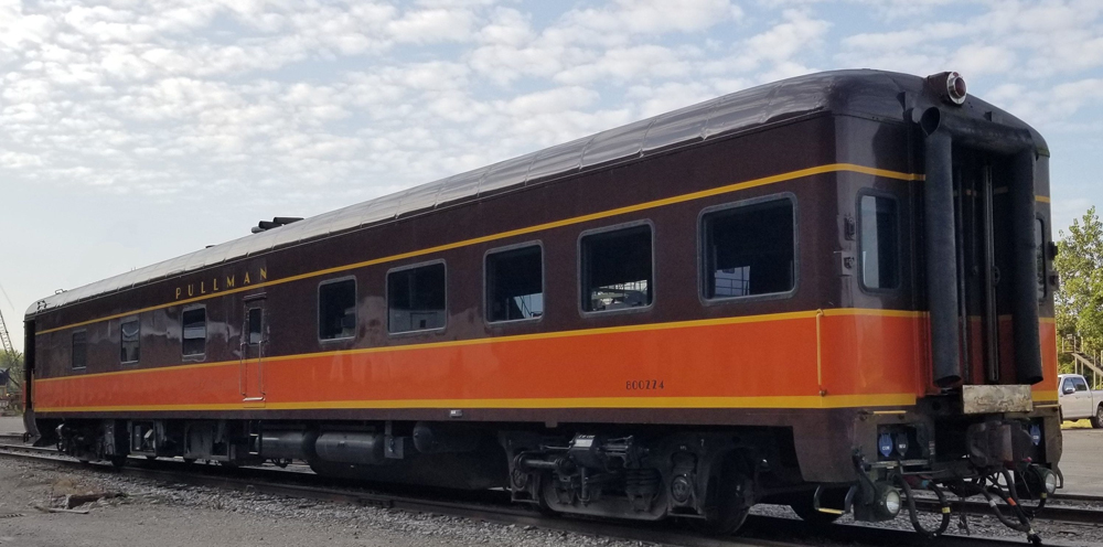 Exterior of pasenger car in Illinois Central brown and orange paint scheme