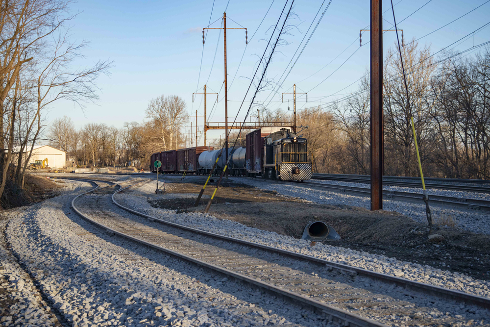 End-cab switcher with car in small yar