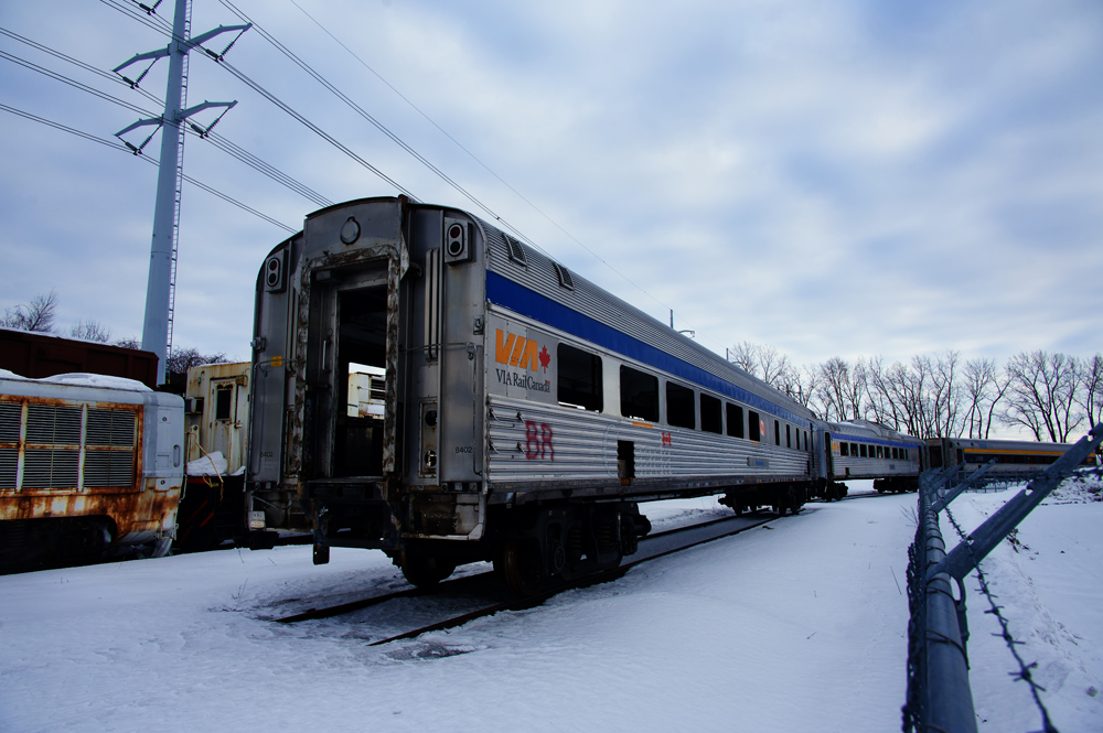 Stripped-down passenger car parked in snow