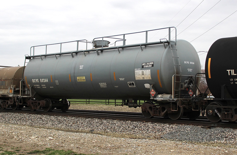Gray tank car labled "vinyl chloride, stabilized"