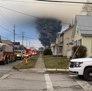 Black cloud of smoke above town