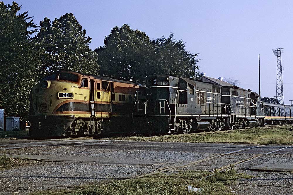 Three quarter view of diesel-powered Kansas City Southern locomotives in yard