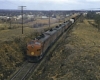 Overhead view of seven diesel-powered Kansas City Southern locomotives with freight train