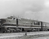 Three quarter view of diesel-powered Kansas City Southern locomotives in yard