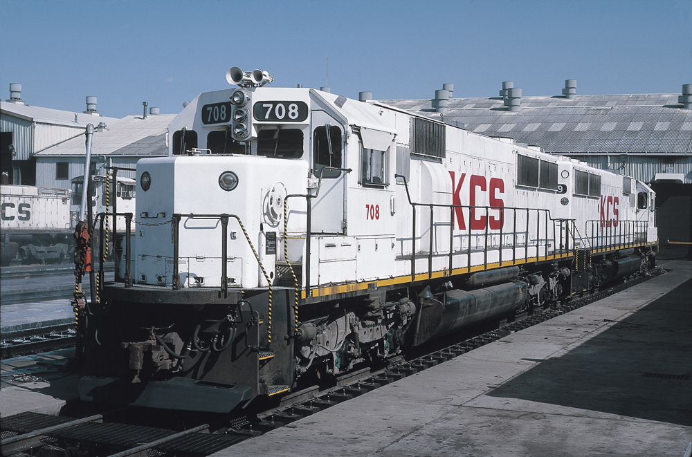 White Kansas City Southern locomotives at a service facility