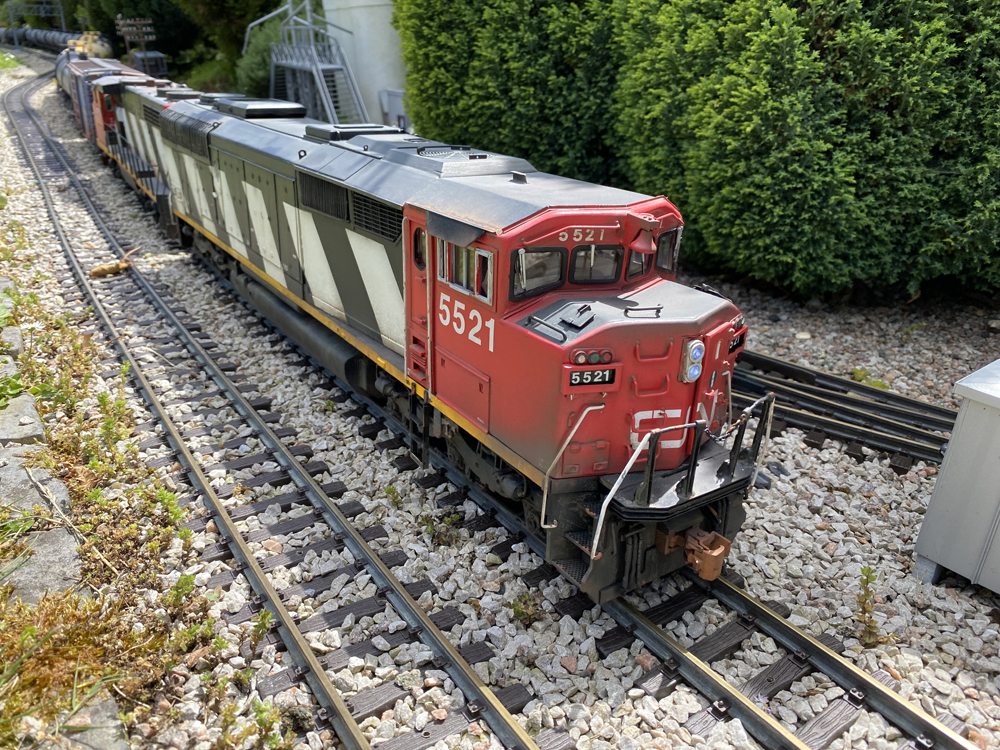 red, white, and black model locomotive