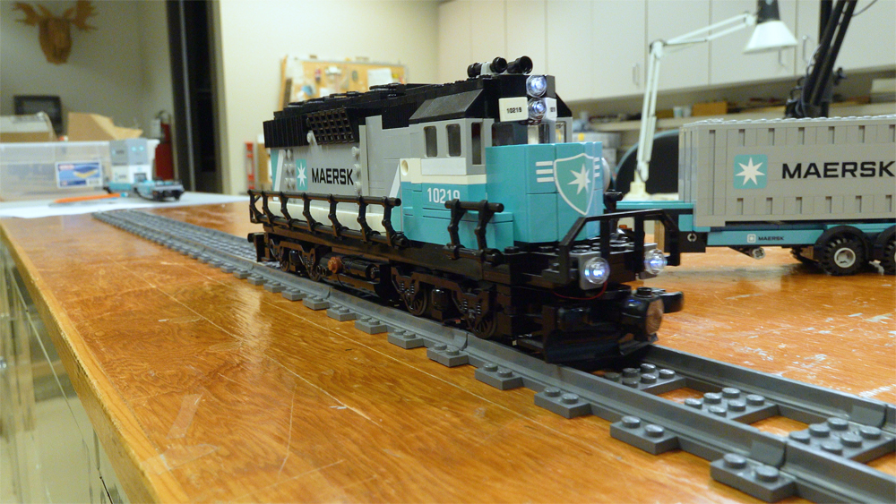 A Lego train locomotive with lights