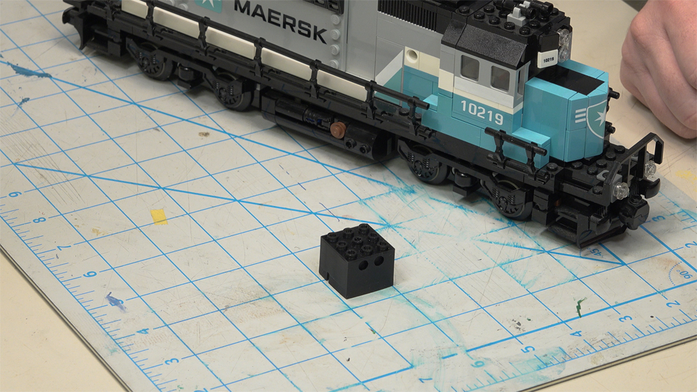 Lego diesel locomotive with 3D-printed speaker enclosure in front
