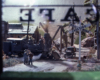 Color photo of model steam locomotive through cafe window