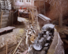 Color photo of steam locomotive on model railroad.