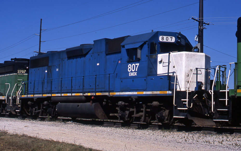 Color photo of blue-and-white diesel locomotive.