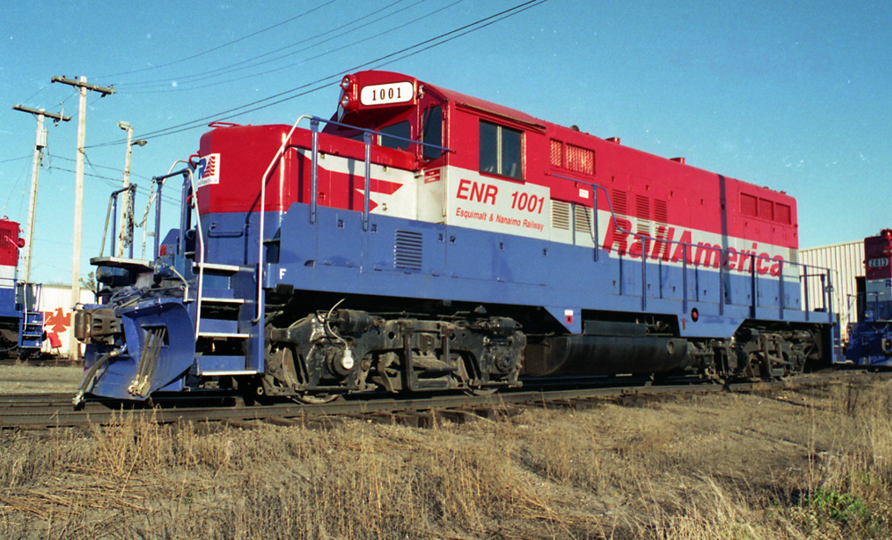 Color roster photo of red, silver, and blue diesel locomotive.