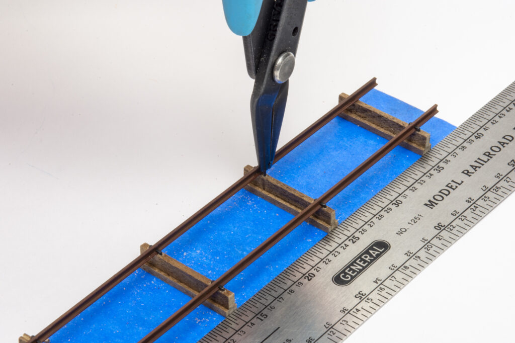 Photo of grain door storage rack with spiking pliers.