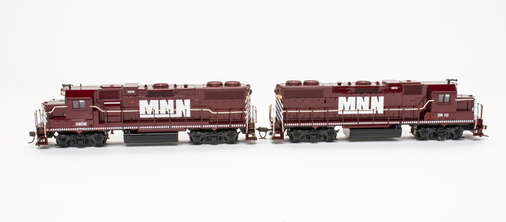 Photo of two HO scale models on white background