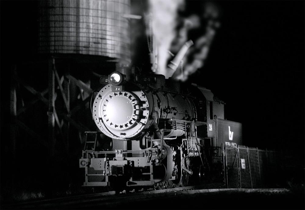 A black and white image of a locomotive