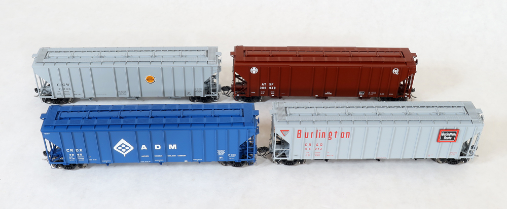 An image of four model freight cars