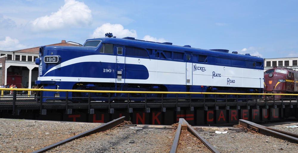 Blue and white diesel on turntable.