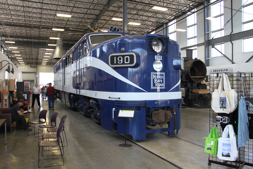 Blue and white locomotive in building