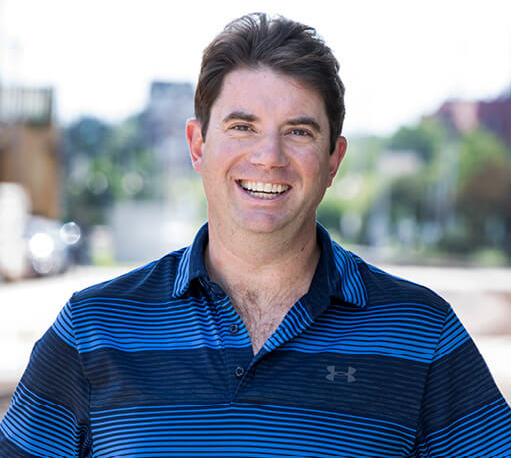Smiling man in blue polo shirt. first-mile, final-mile markets