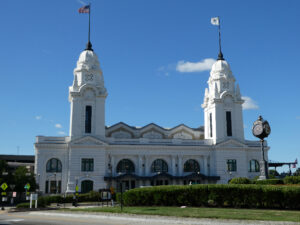 White-color train station with twin towers. High iron baseball — AAA minor league stadiums.