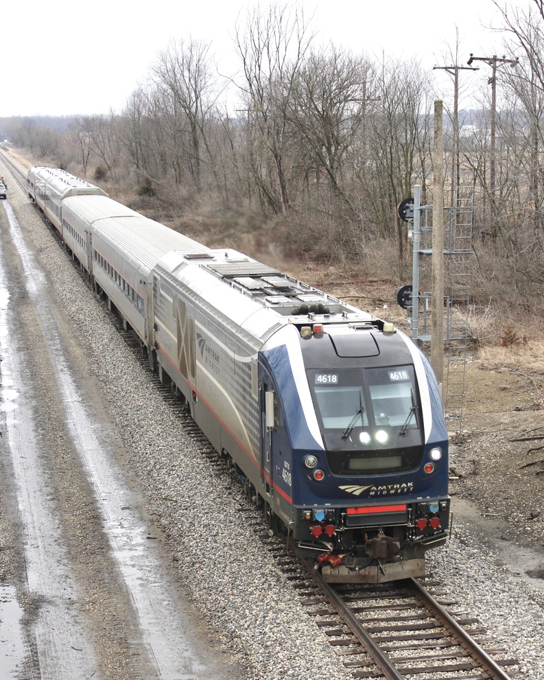 Passenger train under gray skies
