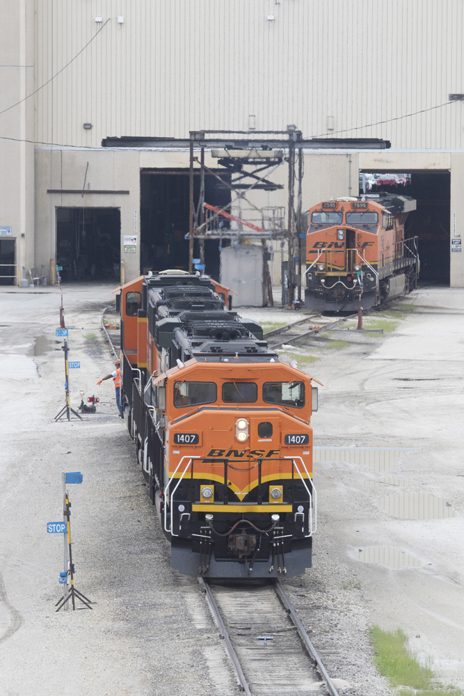 Locomotives outside shop building