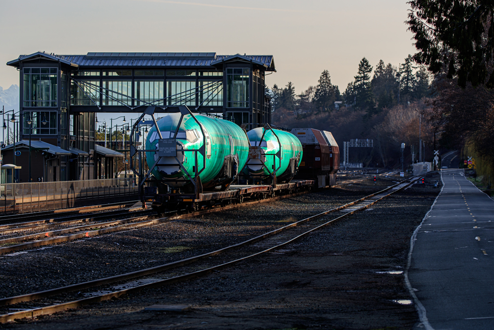 Airplane bodies on flatcars parked on siding