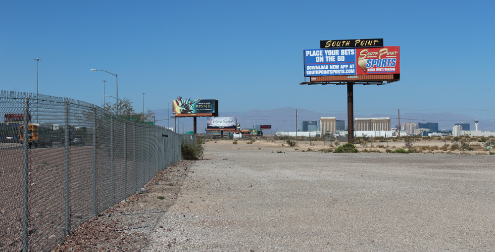 Vacant land with buildings of Las Vegas Strip in the distance