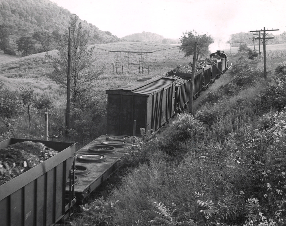 Overhead shot of mix-freight train with a flatcar and boxcar in the foreground.