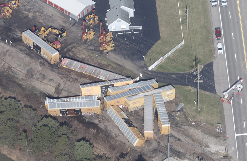 Aerial view of derailed boxcars and auto rack