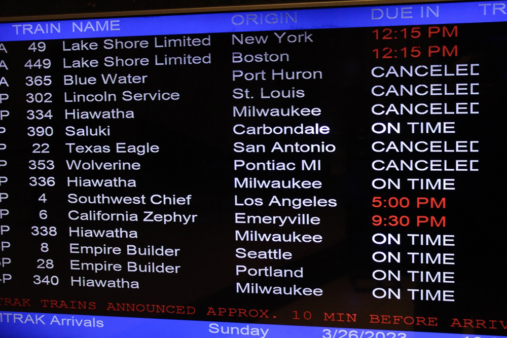 Video board at Chicago Union Station showing list of canceled trains