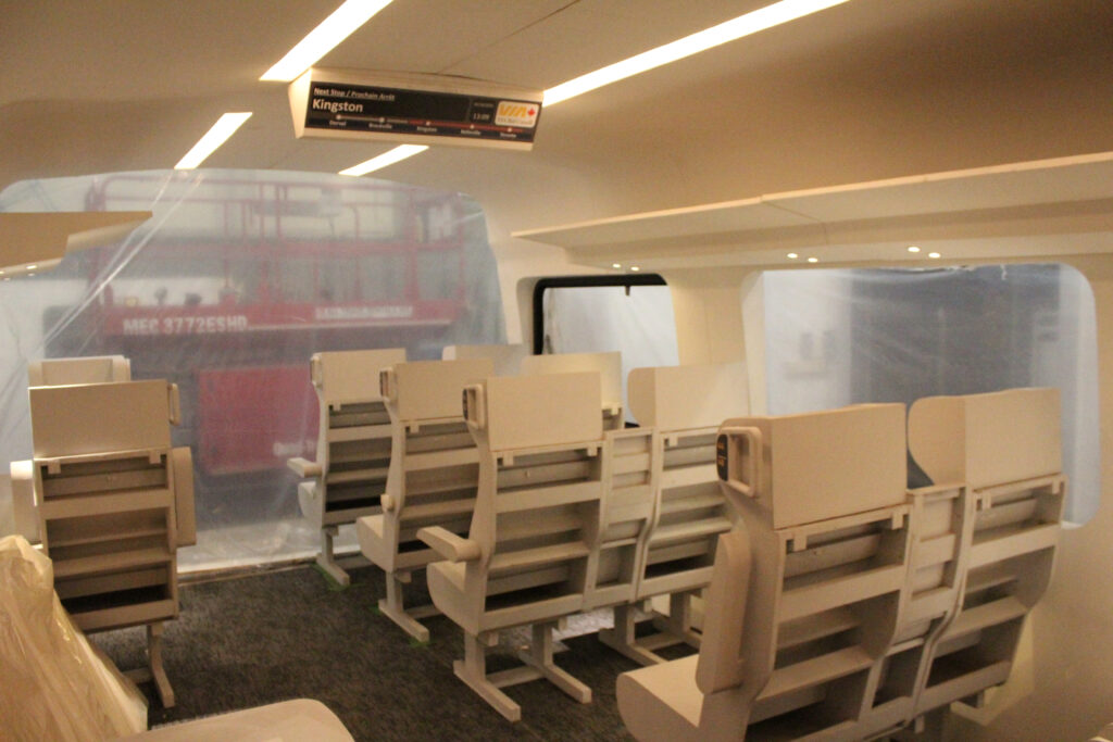 Mock-up of passenger car interior with wooden car seats