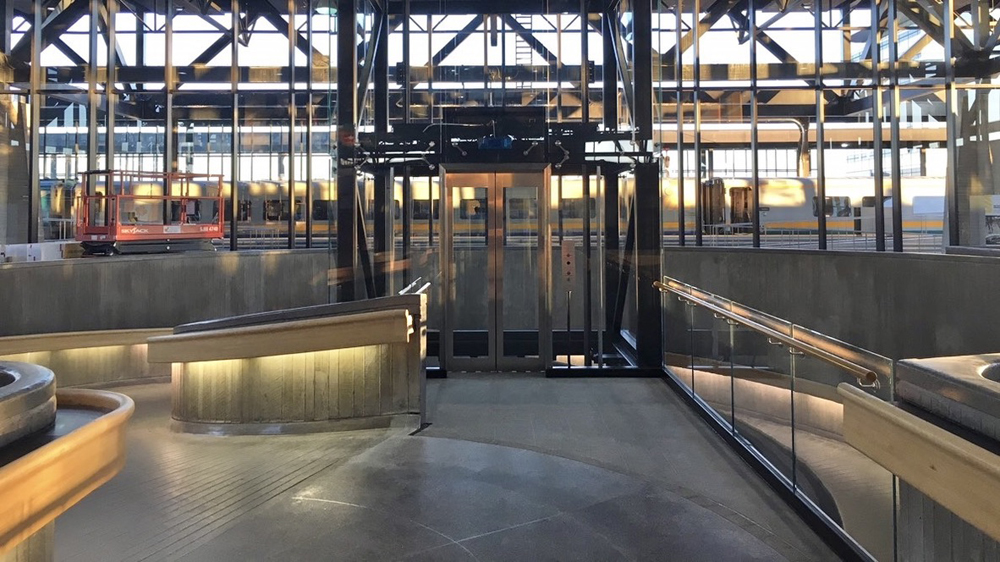 Interior of railroad station showing raps and doorway