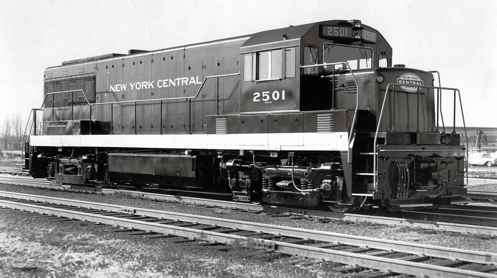 Black-and-white diesel locomotive in rail yard