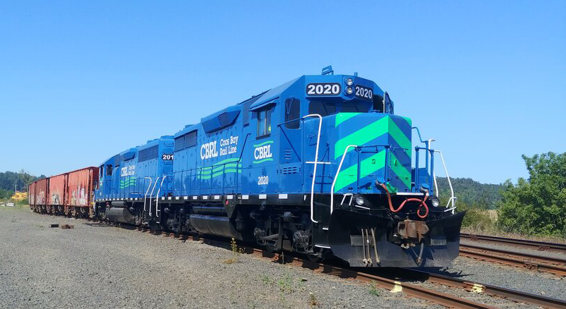 Blue diesel locomotive with green nose stripes