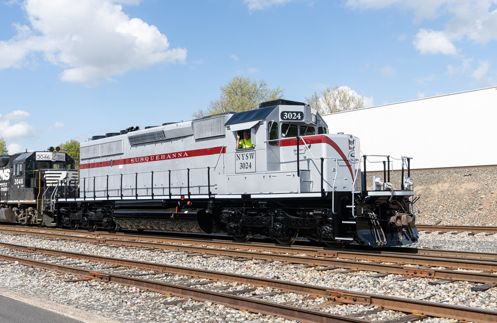 Silver, maroon, and black diesel locomotive