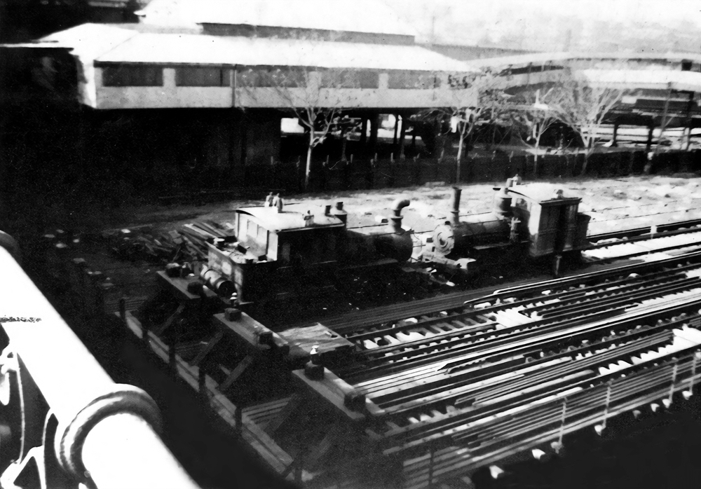 High-contrast black-and-white image of two locomotives