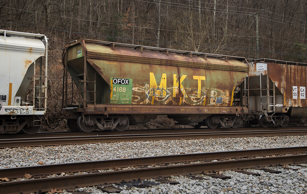 An old freight car covered with graffiti.