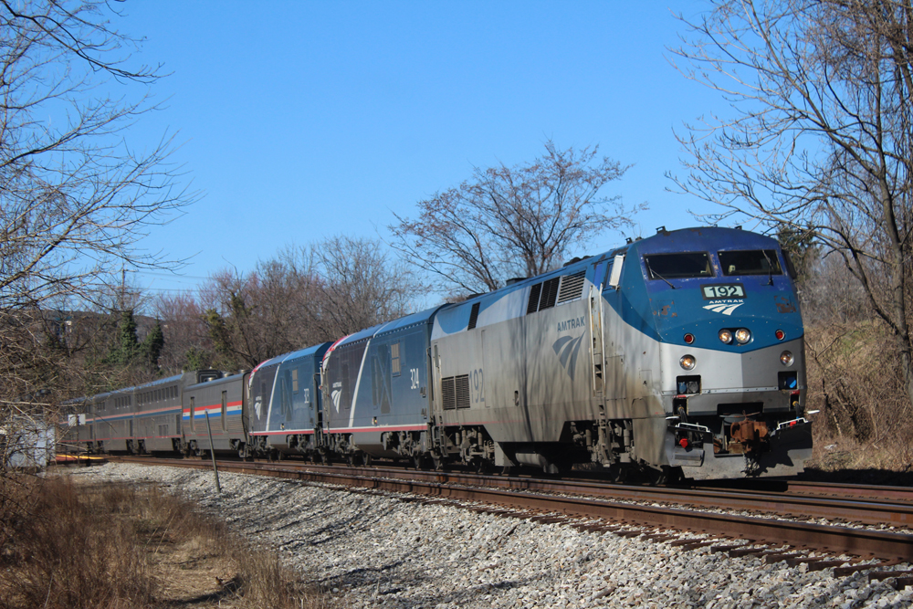 Passenger train with three locomotives and four cars