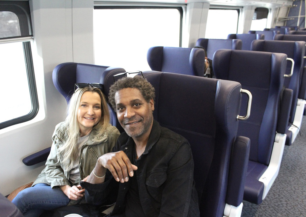 Two people sitting in passenger car