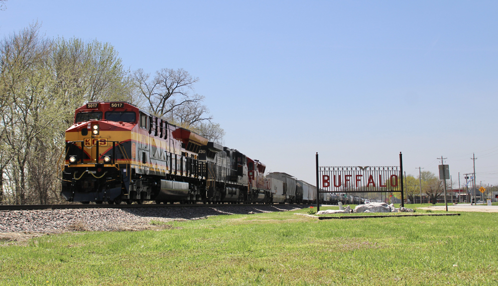 Freight train passes sign for town of Buffalo, Iowa