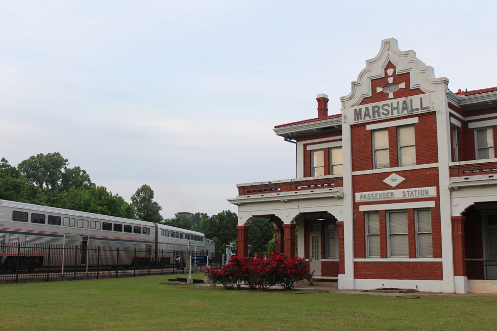 Passenger train at ornate brick station